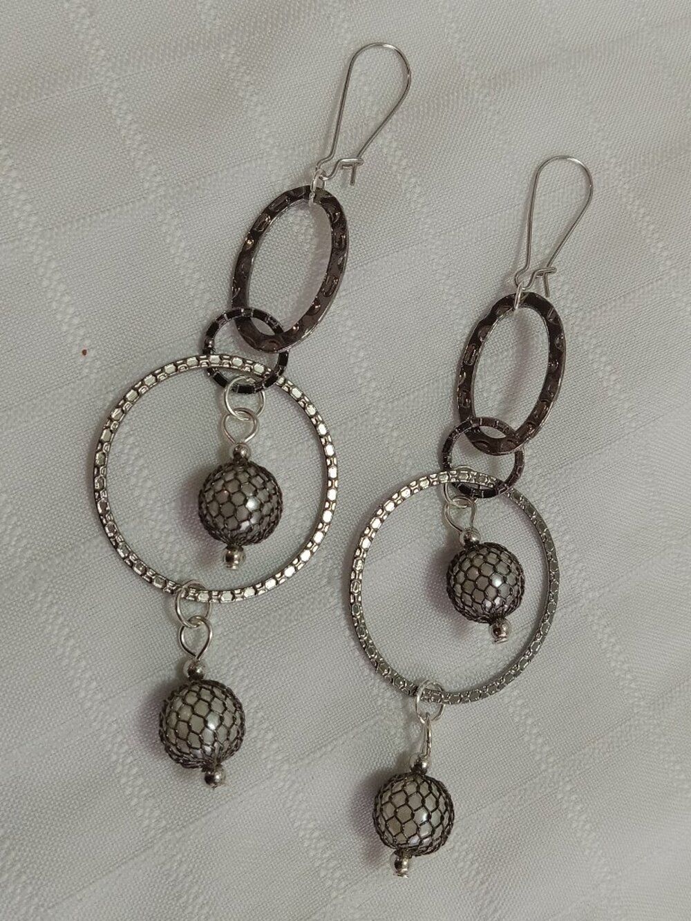 Unique handmade earrings in a silver color